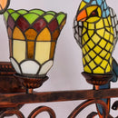 Design-Wandleuchte aus farbigem Glas mit Papageienmotiv