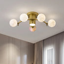 plafonnier design en métal noir doré boule blanche pour intérieur moderne