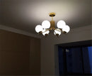 Moderner LED-Kronleuchter mit Lampenschirm aus goldfarbenem Metall