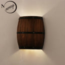 Retro-Wandleuchten in Fass-Optik aus Holz