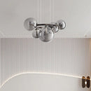 Design-Kronleuchter mit Glaskugel und runder Metallstrebe