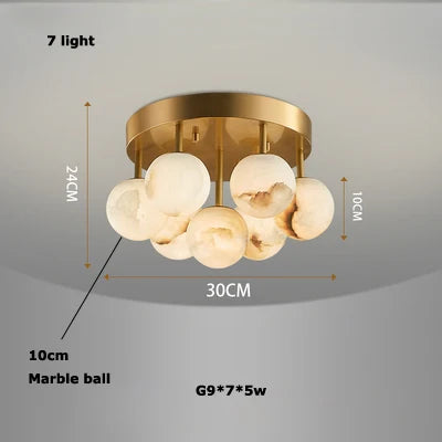 lustre à bulles en marbre or et noir design moderne pour intérieur