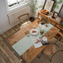 Chemin de table géométrique beige noir à pompons