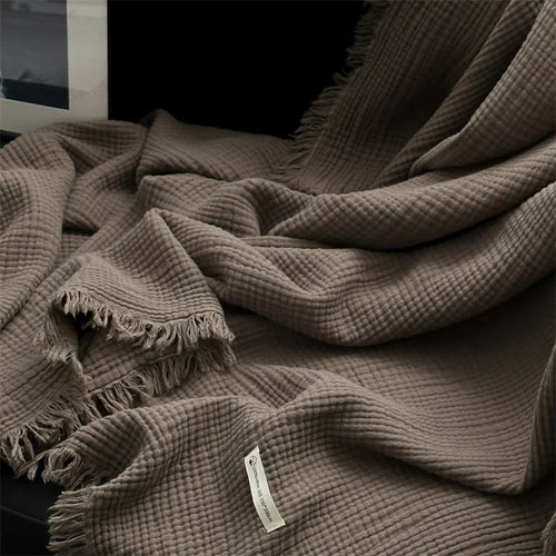 Plaid coton doux a carreaux avec pompons salon