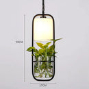Suspension moderne en cage avec abat-jour en verre et fer