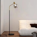 Elegante Stehleuchte in Gold und Schwarz aus Metall und Glas