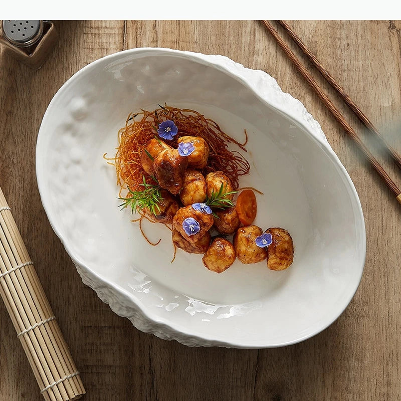 Assiette creuse ovale style coquillage motif roche minimaliste