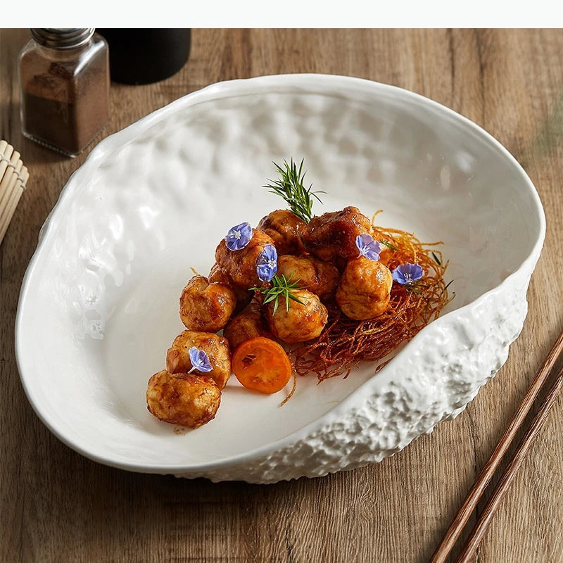 Assiette creuse ovale style coquillage motif roche minimaliste