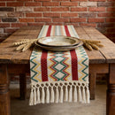 Chemin de table bohème motif aztèque tissé pompons