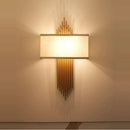 Design-Wandleuchte aus Kristall und goldfarbenem Edelstahl