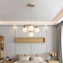 suspension en bois avec boule de verre design moderne