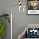 Elegante Stehleuchte in Gold und Schwarz aus Metall und Glas
