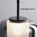 Moderne LED-Pendelleuchte aus rauchgrauem Glas mit drei Köpfen