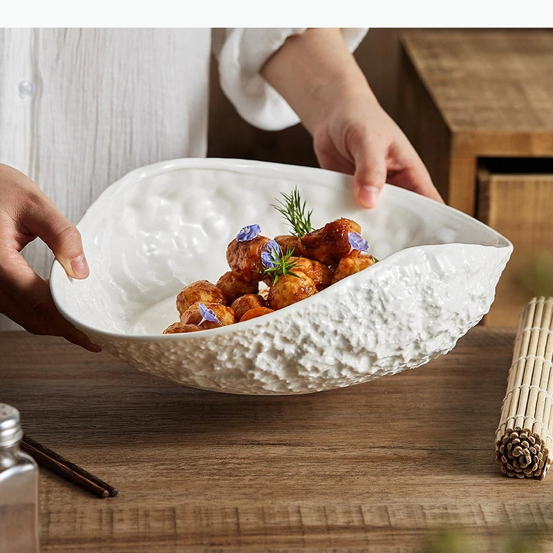 Assiette creuse ovale style coquillage motif roche minimaliste
