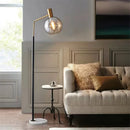 Elegante Stehleuchte in Gold und Schwarz aus Metall und Glas