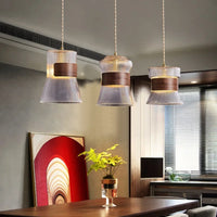 Suspension moderne en verre transparent avec détails en bois et cuivre