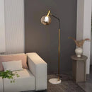 Elegante Stehleuchte in Gold und Schwarz aus Metall und Glas