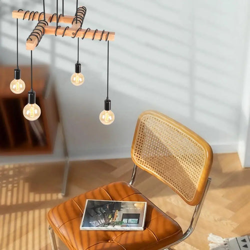 plafonnier industriel vintage avec 4 têtes de lampes suspendues
