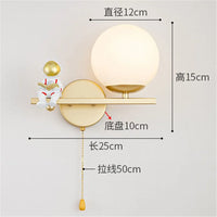 LED-Wandleuchte Astronaut aus goldenem Glas für Kinderzimmer