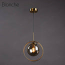Suspension design boule en verre fumé Hang