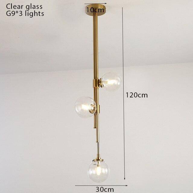 Suspension tube doré et boules en verre moderne