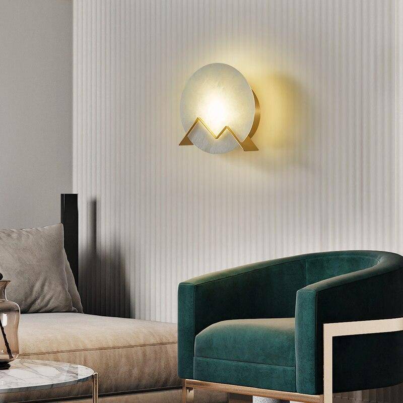 Applique murale design LED avec cercle en marbre et métal doré