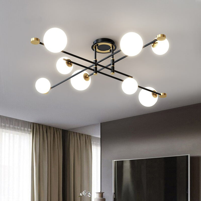 Lustre moderne LED bras croisés noirs et détails dorés Poline