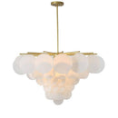 Lustre design avec branches dorées et boules en verre