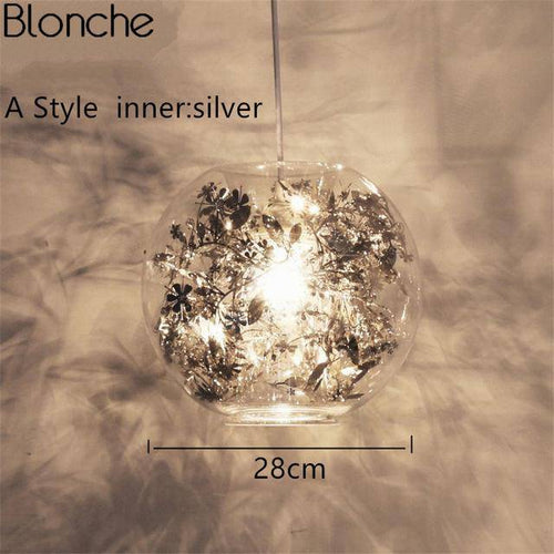 Lampe à poser boule en verre avec feuilles