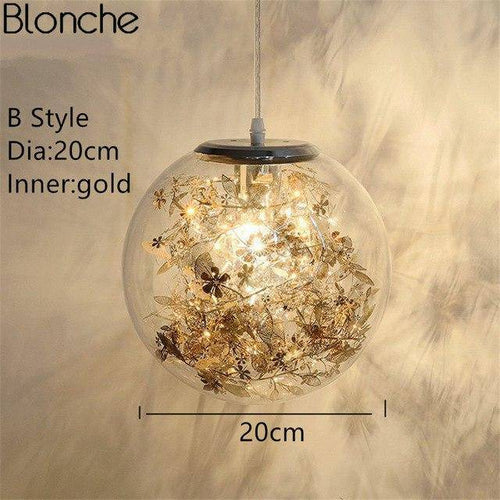 Lampe à poser boule en verre avec feuilles